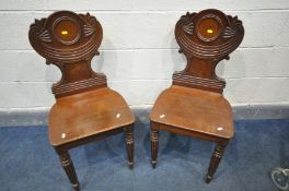 A PAIR OF WILLIAM IV MAHOGANY HALL CHAIRS, the back with ribbon decoration, on fluted front legs