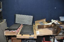 FOUR NEW BUT SLIGHTLY DAMAGED CAR RADIATORS in boxes no indication of makes or models of vehicles