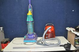 A HOOVER SENSORY 1900 VACUUM CLEANER and a Dyson DC07 upright vacuum cleaner (some plastic
