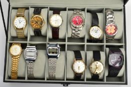 A WATCH DISPLAY CASE WITH WRISTWATCHES, black case with a Perspex lid, twelve storage cushions
