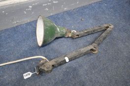 AN INDUSTRIAL ANGLED DESK LAMP, possibly made my Met-Elek, with a green enamel shade (distressed