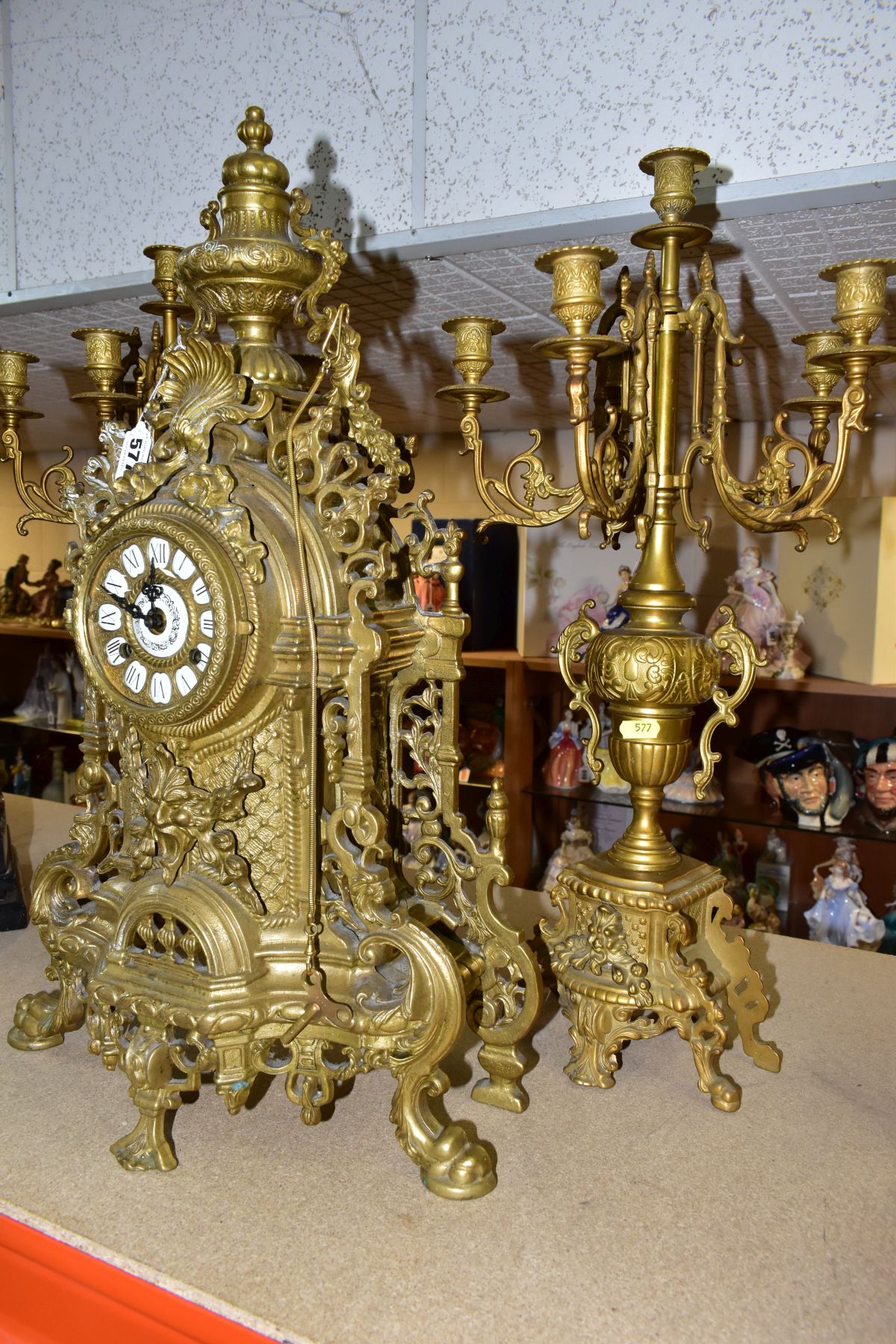 A REPRODUCTION BRASS CLOCK GARNITURE, the clock with ornate cast brass case with twin handled urn - Image 6 of 9