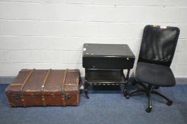 A VINTAGE TRAVELLING TRUNK, 97cm x depth 57cm, an ebonised drop leaf tea trolley, and an office