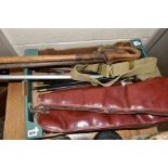 A BOX OF SHOOTING RELATED ITEMS, to include three hardwood two part gun cleaning rods with fittings,