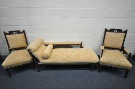 AN EDWARDIAN MAHOGANY PARLOUR SUITE, reupholstered in floral gold upholstery, comprising a chaise