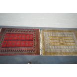 TWO 20TH CENTURY WOOLLEN RUG, one with red field, 186cm x 124cm, and a the other russet field, 198cm