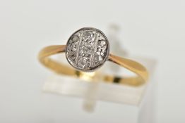 A YELLOW METAL DIAMOND RING, the ring head of a circular design set with three old cut diamonds