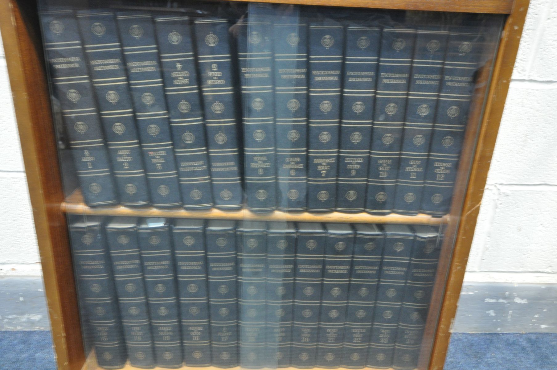 A GLAZED BOOKCASE, containing the Britannica Dictionary, the new book of Knowledge and Encyclopaedia - Image 2 of 4