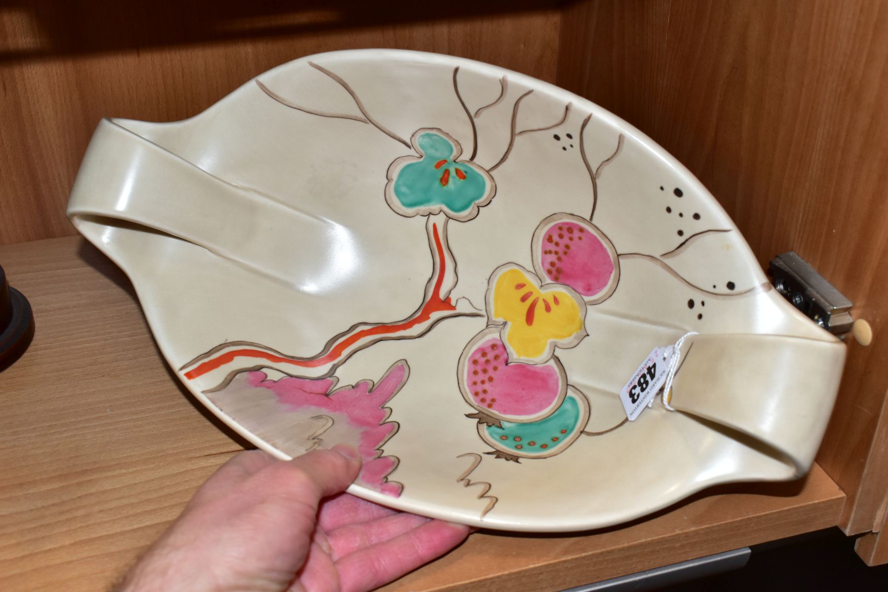 A CLARICE CLIFF WILKINSON LTD POTTERY TWIN HANDLED OVAL BOWL PAINTED WITH A FRUITING POMEGRANATE - Image 2 of 4