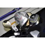 A BOX OF VARIOUS GOLF CLUBS to include nine Ping golf, clubs, a selection of putters such as John