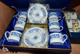 A BOXED COALPORT REVELRY COFFEE SET, comprising six coffee cans and six saucers in a fitted box (set