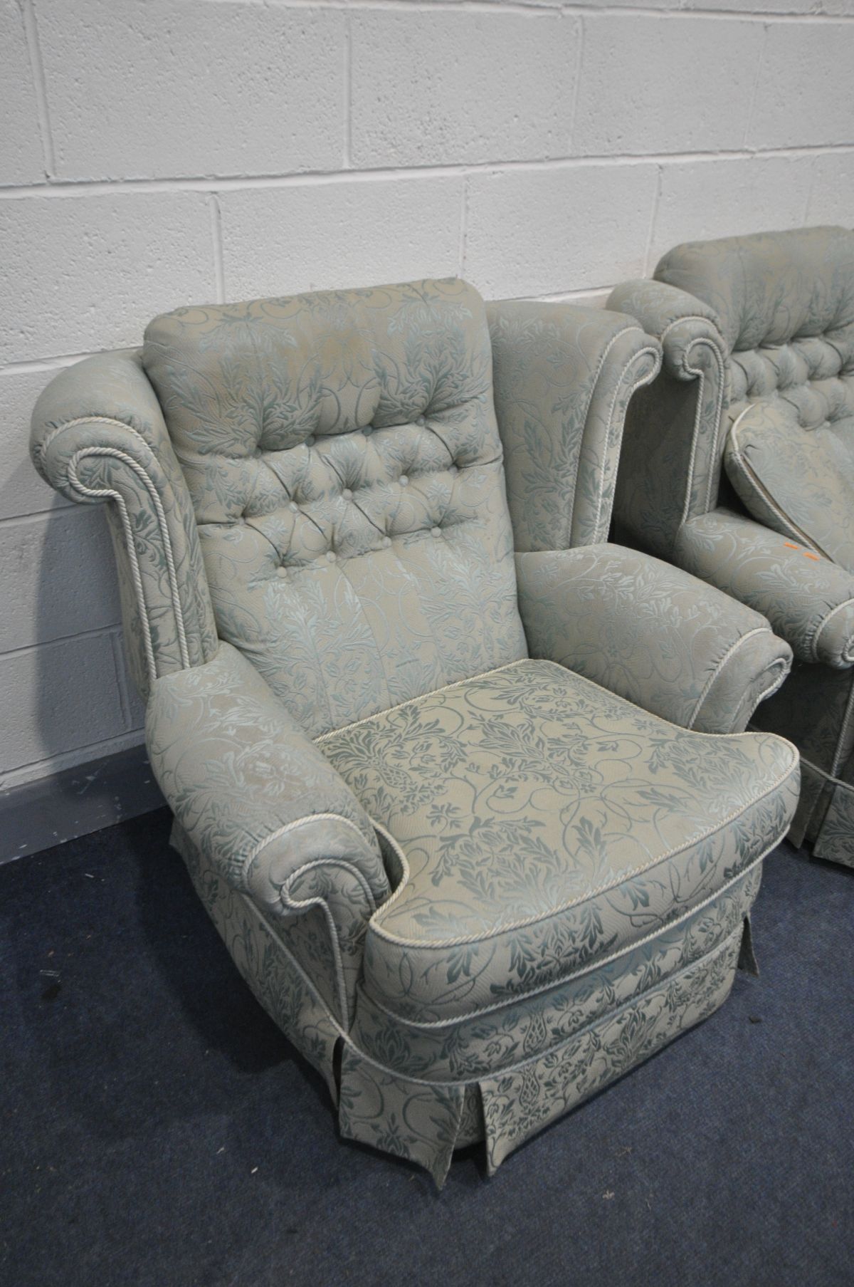 A FLORAL GREEN UPHOLSTERED LOUNGE SUITE, comprising a three seater sofa, pair of armchairs and a - Image 3 of 3