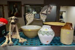 FIVE CERAMIC ITEMS AND A DECORATIVE MODEL ROCKING HORSE, comprising a pottery figure of a seated