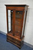 A BRADLEY MAHOGANY GLAZED TWO DOOR BOOKCASE, with three glass shelves, over three drawers, width