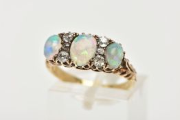AN EARLY 20TH CENTURY OPAL AND DIAMOND DRESS RING, designed with three oval opal cabochons,