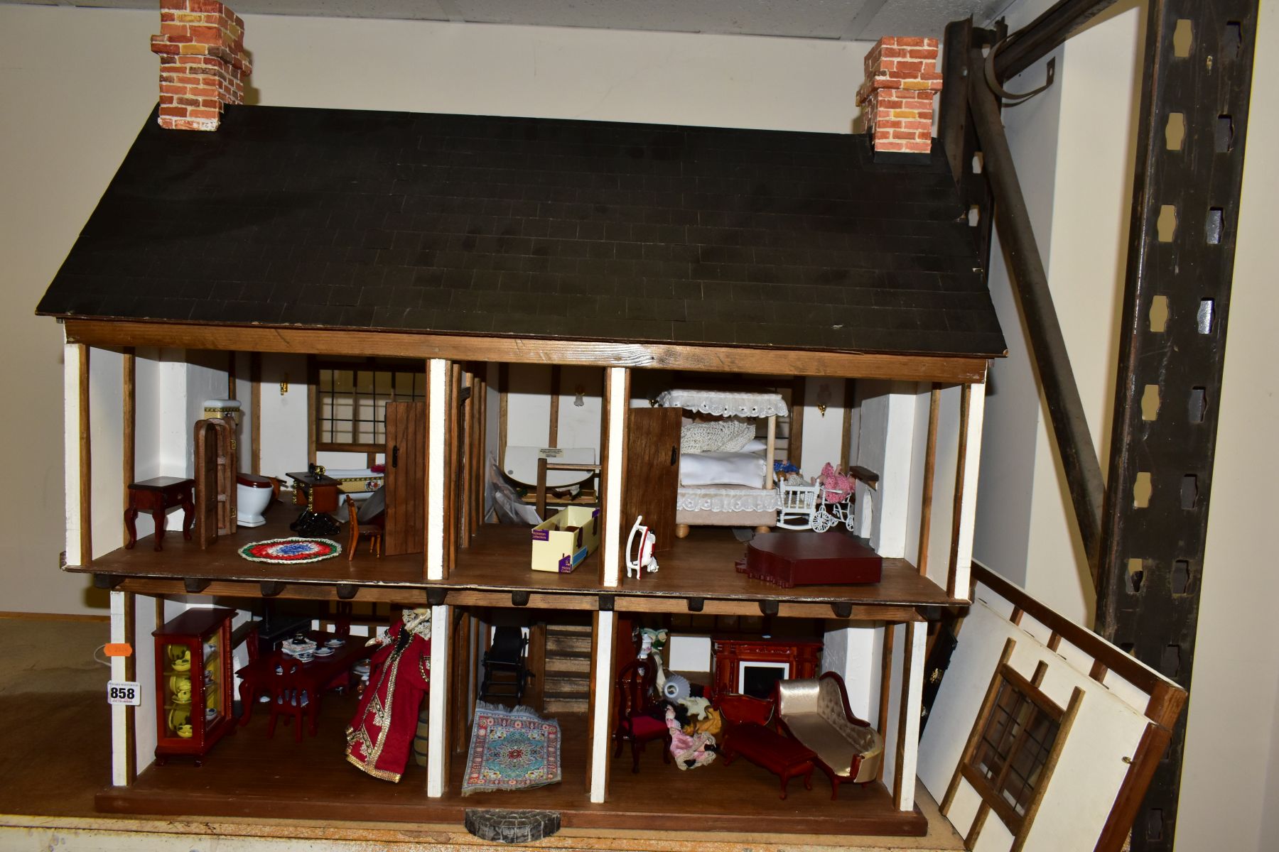A DOLLS HOUSE, exterior in Tudor style, with four rooms, hallway, stairs and landing, a two - Image 5 of 5