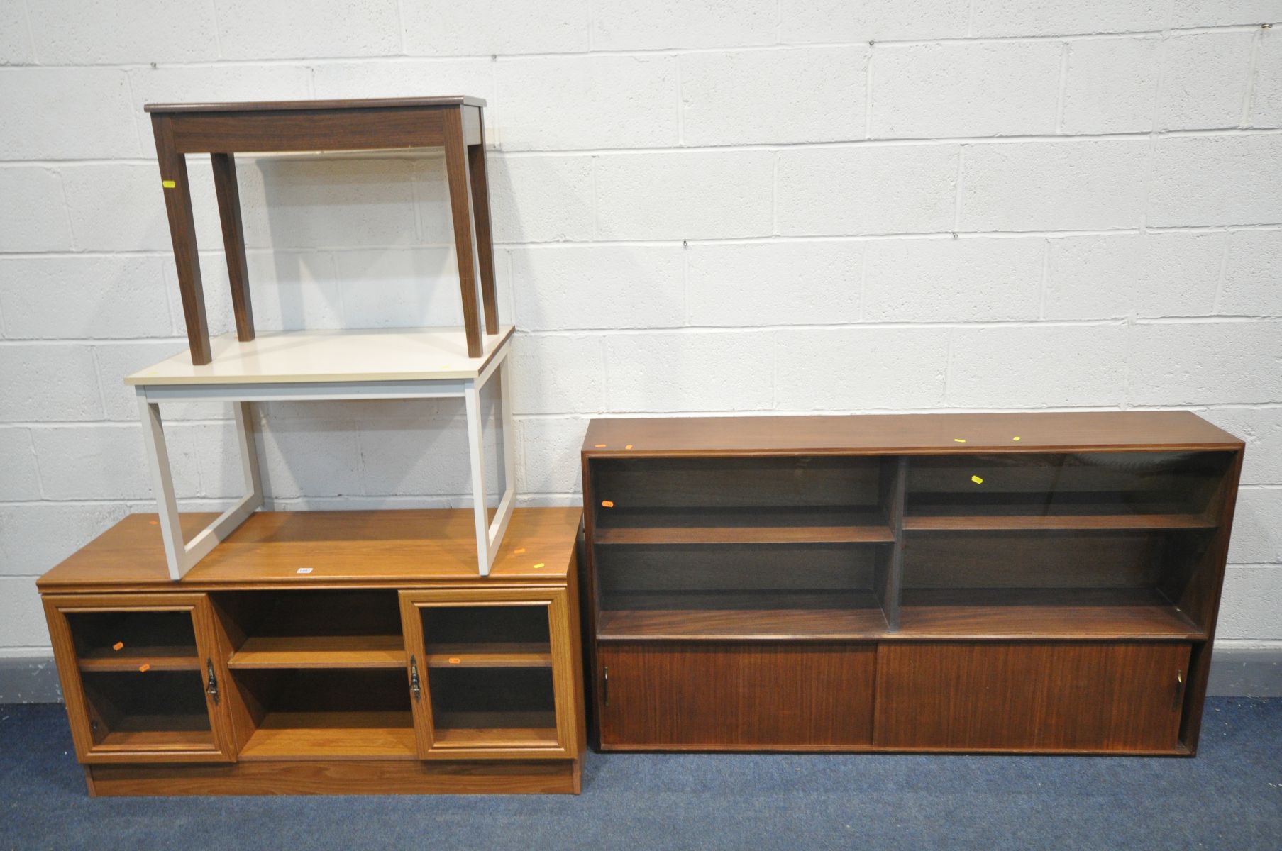 A MID CENTURY AFROMOSIA TEAK GLAZED BOOKCASE, width 153cm x depth 28cm x height 84cm (missing base