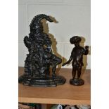 A 20TH CENTURY BRONZE FIGURE OF A PUTTI AND A CAST IRON MR PUNCH DOORSTOP, the bronze cast wearing a