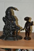 A 20TH CENTURY BRONZE FIGURE OF A PUTTI AND A CAST IRON MR PUNCH DOORSTOP, the bronze cast wearing a