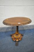 AN EARLY VICTORIAN ROSEWOOD OVAL OCCASIONAL TABLE, the later mahogany top with a carved border, on a