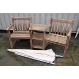 A MODERN HARDWOOD GARDEN LOVE SEAT with angle centre shelf, parasol and cover 180cm wide