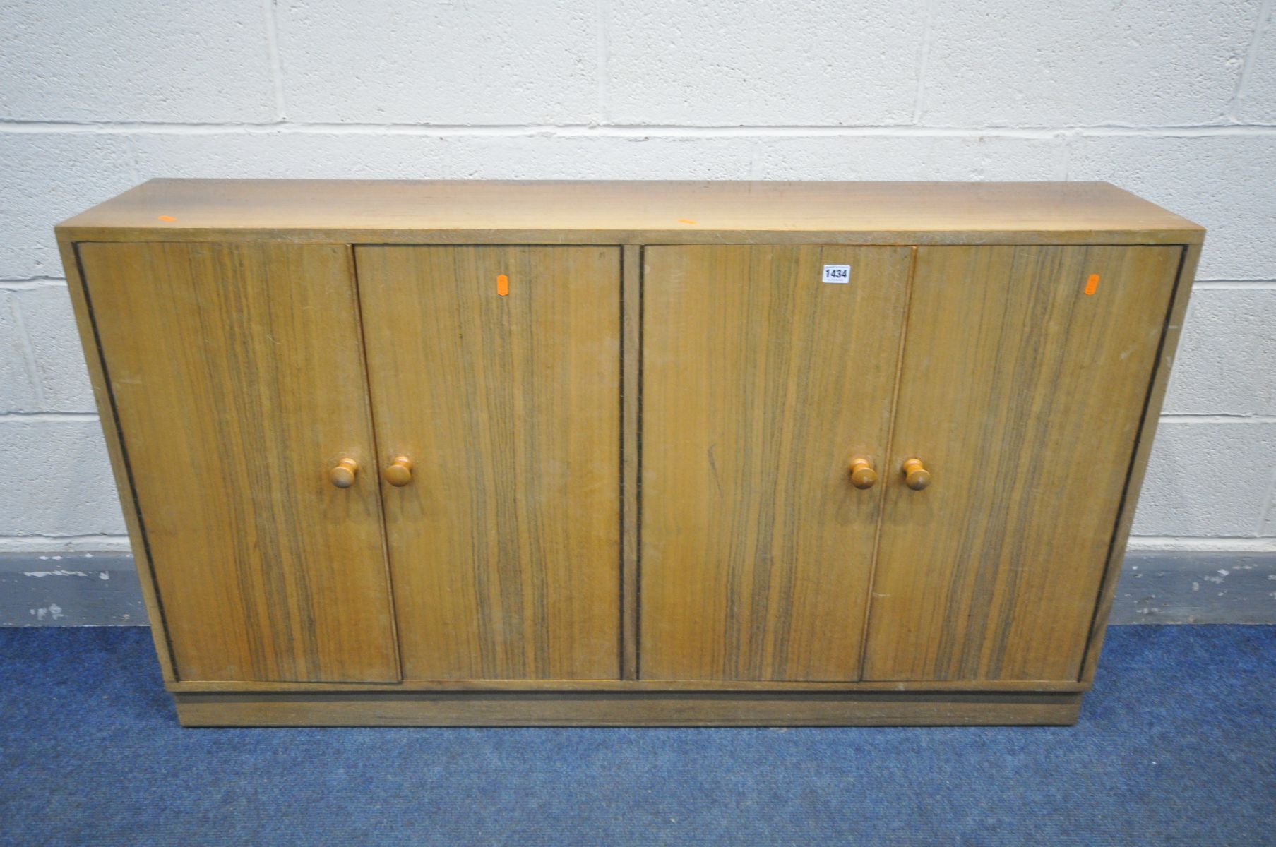 A MORRIS OF GLASGOW WALNUT TWIN DOUBLE DOOR BOOKCASE, width 136cm x depth 28cm x height 78cm