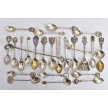 AN ASSORTMENT OF SILVER AND WHITE METAL TEASPOONS, to include eleven silver hallmarked commemorative