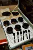 A BOXED BLACK LACQUER TEA SET comprising a mid-20th Century lacquer tea set in a fitted case, six