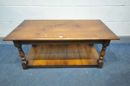 A SOLID OAK TITCHMASH AND GOODWIN COFFEE TABLE, on turned supports united by an undershelf, width