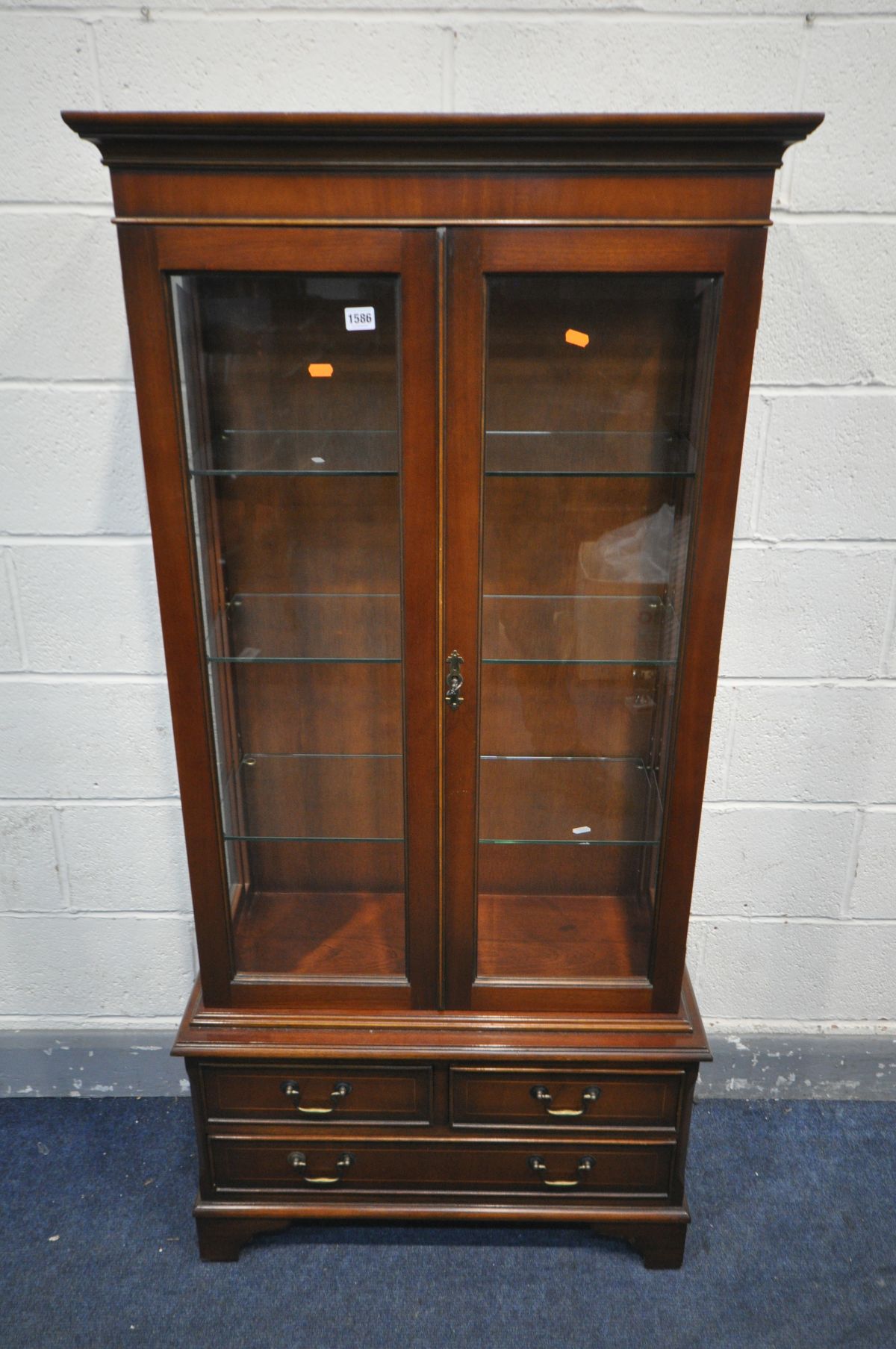 A BRADLEY MAHOGANY GLAZED TWO DOOR BOOKCASE, with three glass shelves, over three drawers, width - Image 2 of 2