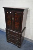 A MAHOGANY TWO DOOR DRINKS CABINET, over a single cupboard door, width 63cm x depth 50cm x height