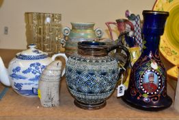 A SMALL GROUP OF CERAMICS AND GLASSWARES, to include a Doulton Lambeth jug, with applied decoration,