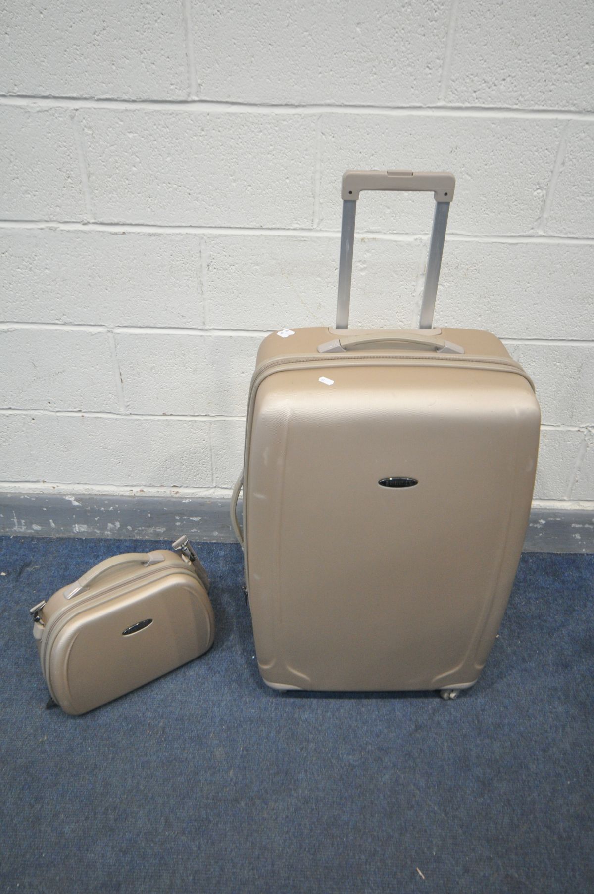 A REVOLATION HARD SHELL SUITCASE, and a matching holdall suitcase (2)