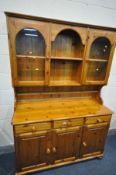 A PINE DRESSER, with three drawers, width 132cm x depth 44cm x height 190cm x height 89cm