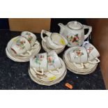 A TWENTY ONE PIECE SYLVAN NURSERY WARE TEA SET, printed with Nursery Rhyme characters, comprising