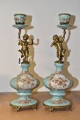 A PAIR OF REPRODUCTION TURQUOISE PORCELAIN AND BRASS FIGURAL CANDLEHOLDERS OF LATE 19TH CENTURY