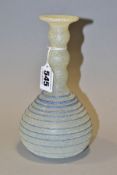 A ROMAN STYLE ONION SHAPED GLASS VASE, the textured opaque ground with a bobbin shaped neck above