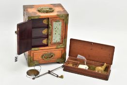 A WOODEN CHINESE JEWELLERY BOX AND A CASES SET OF SCALES, a two door one draw wooden jewellery