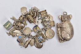 A WHITE METAL CHARM BRACELET WITH SILVER AND WHITE METAL CHARMS, a curb link charm bracelet,