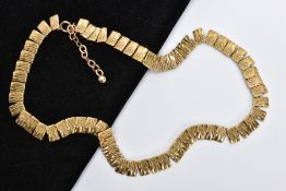 A 9CT GOLD CLEOPATRA NECKLACE, textured gold panels interlinked together, fitted with a spring clasp