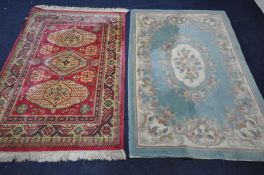 A GREEN CHINESE RUG, 185cm x 127cm, and a red ground rug (2)