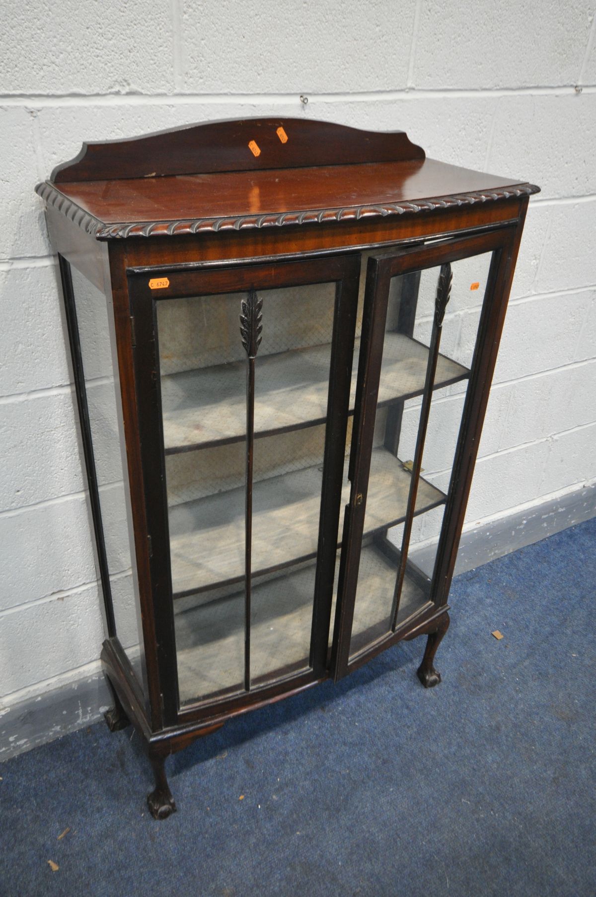 A MAHOGANY TWO DOOR CHINA CABINET, on ball and claw feet, width 75cm x depth 31cm x height 127cm (