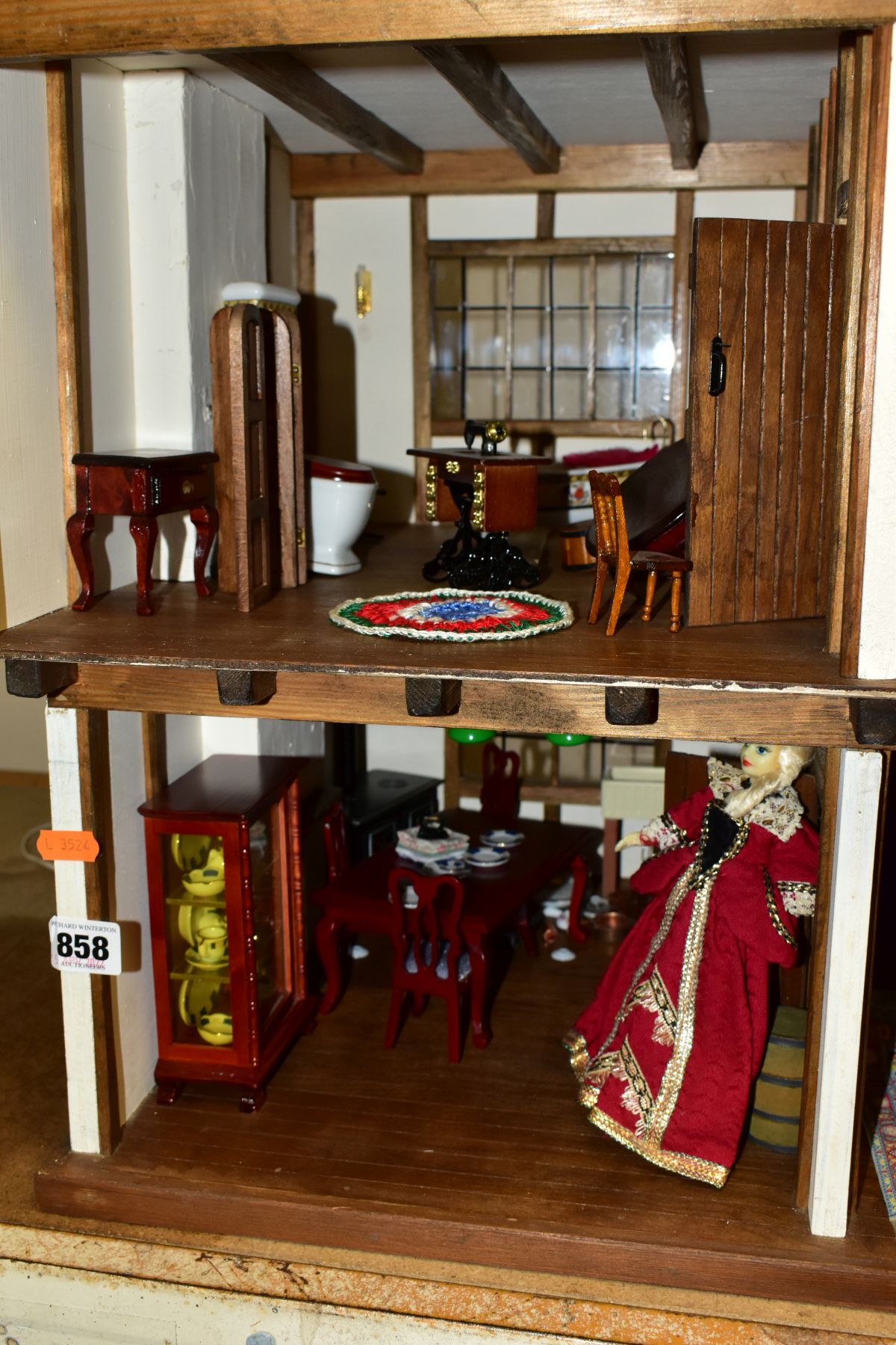 A DOLLS HOUSE, exterior in Tudor style, with four rooms, hallway, stairs and landing, a two - Image 2 of 5