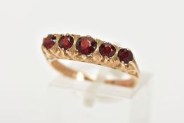 A LATE 20TH CENTURY FIVE STONE GARNET RING, designed with a row of five slightly graduated, circular