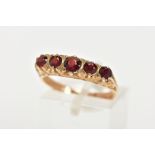 A LATE 20TH CENTURY FIVE STONE GARNET RING, designed with a row of five slightly graduated, circular