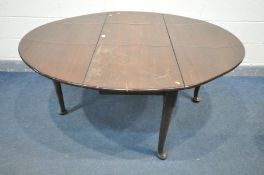 A GEORGE I MAHOGANY CIRCULAR DROP LEAF DINING TABLE, on padded feet, open width 151cm x closed width