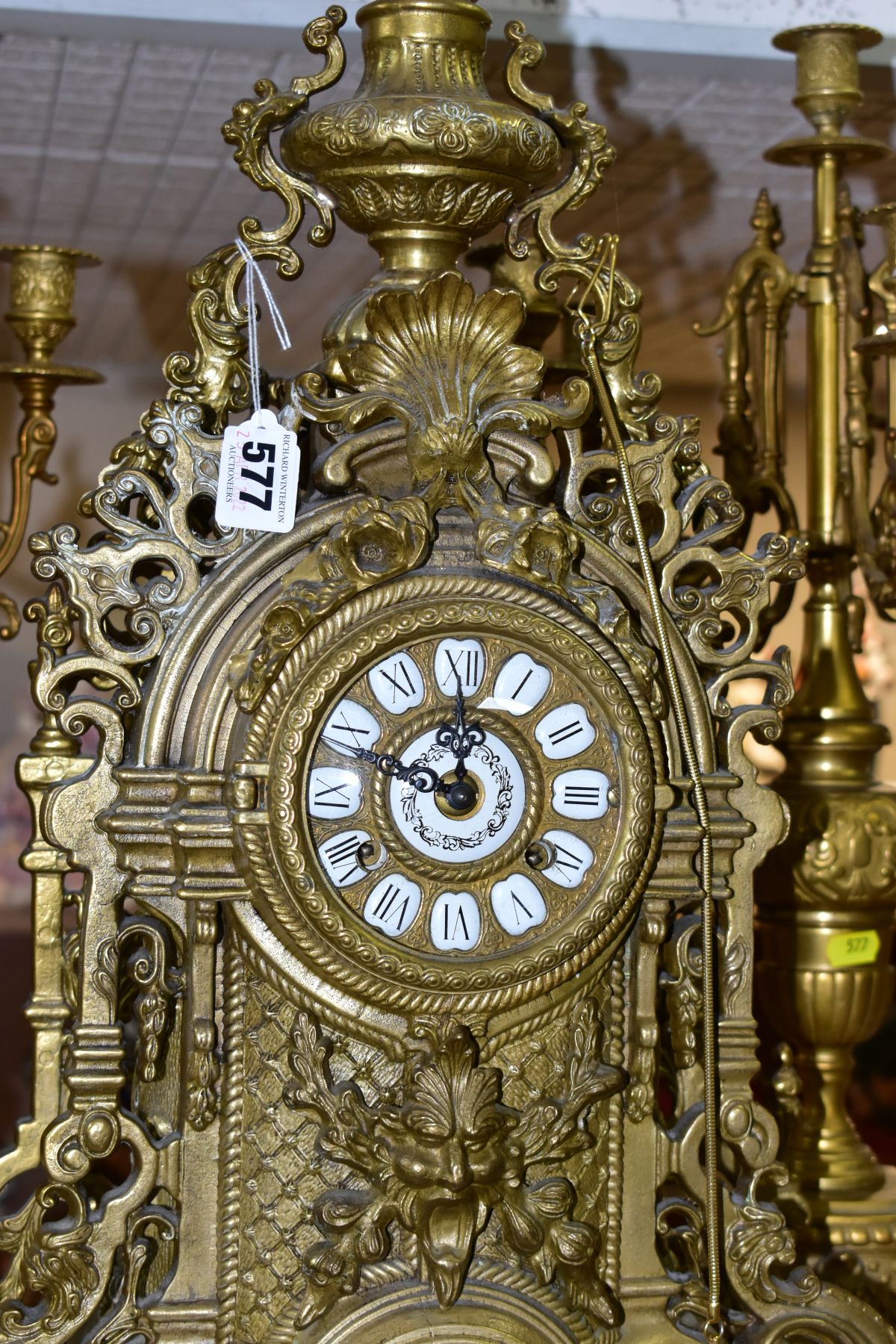 A REPRODUCTION BRASS CLOCK GARNITURE, the clock with ornate cast brass case with twin handled urn - Image 2 of 9