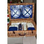 A BROOKES BASKETS WICKER PICNIC HAMPER FOR FOUR PLACE SETTINGS, comprising four Churchill pottery