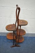 AN EDWARDIAN MAHOGANY DOUBLE SIDED CAKE STAND, height 91cm