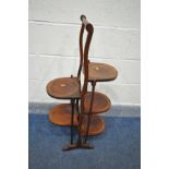 AN EDWARDIAN MAHOGANY DOUBLE SIDED CAKE STAND, height 91cm